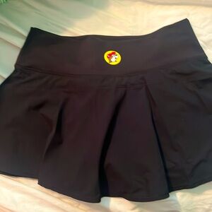 Buc-ee’s active skort has logo on back middle of skort.